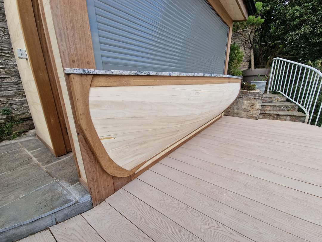 bespoke outdoor carpentry with boat shaped bar