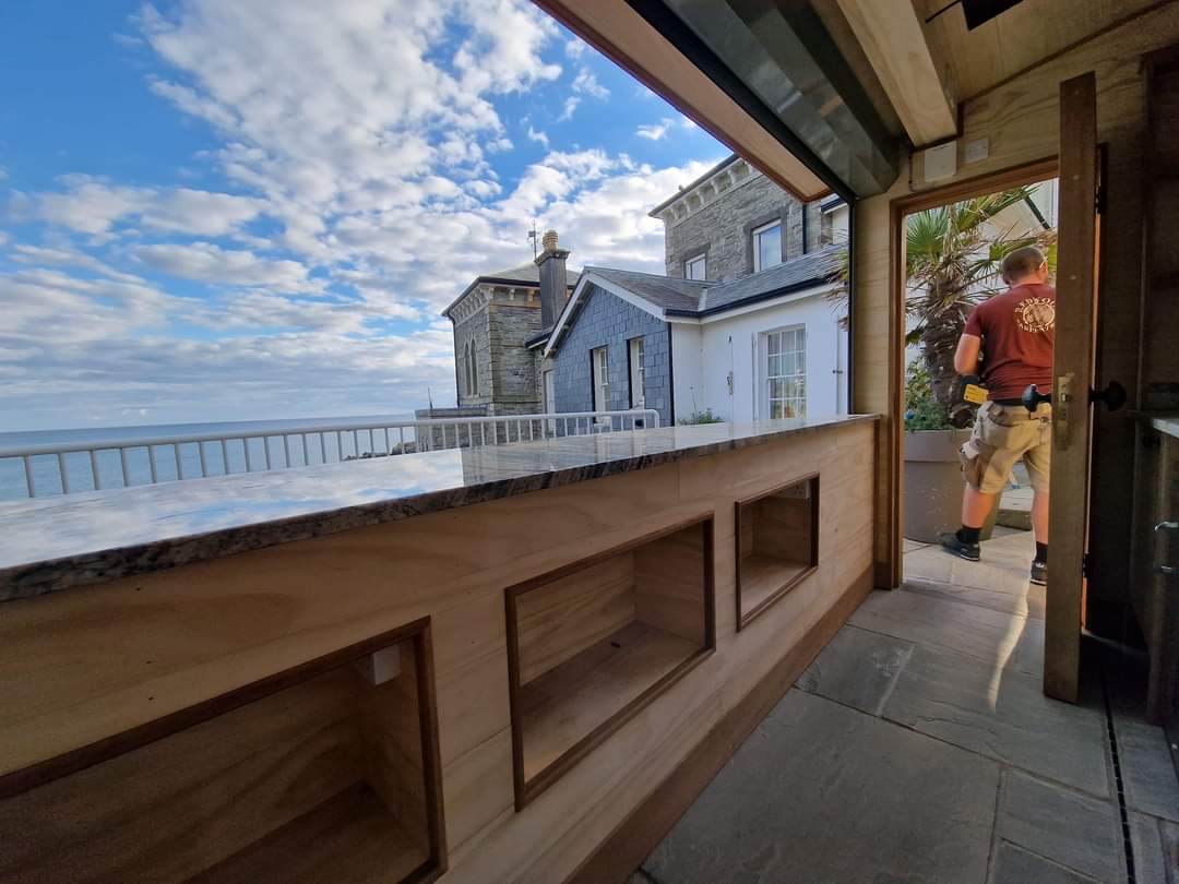 bespoke carpentry outdoor bar with sea view